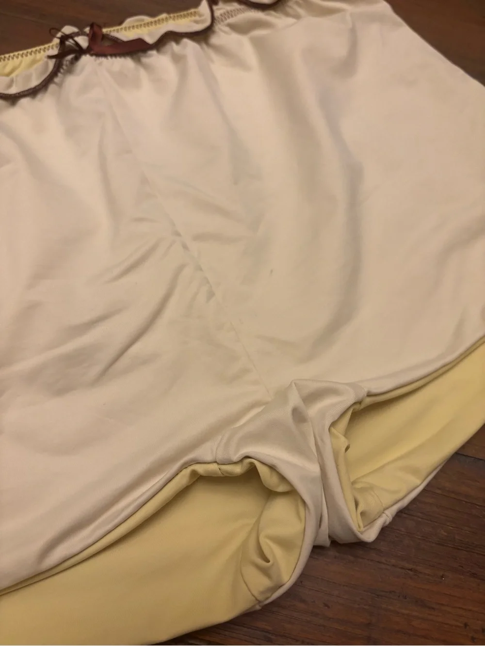 Frankie’s bikinis x Gigi HADID yellow swim shorts with brown trim